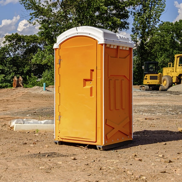 what is the cost difference between standard and deluxe portable restroom rentals in Cayuga